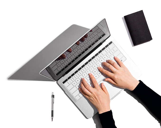 Person using a laptop computer A modern approach to bookkeeping.